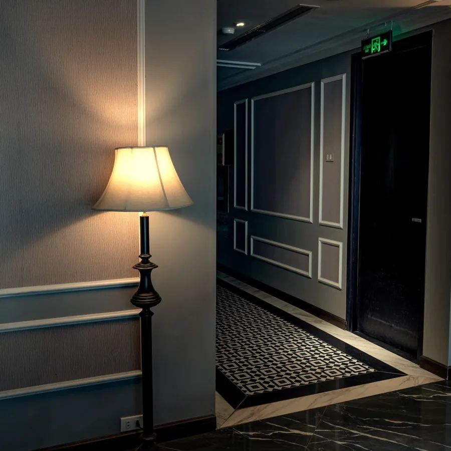 Hotel corridor in the evening with floor lamps