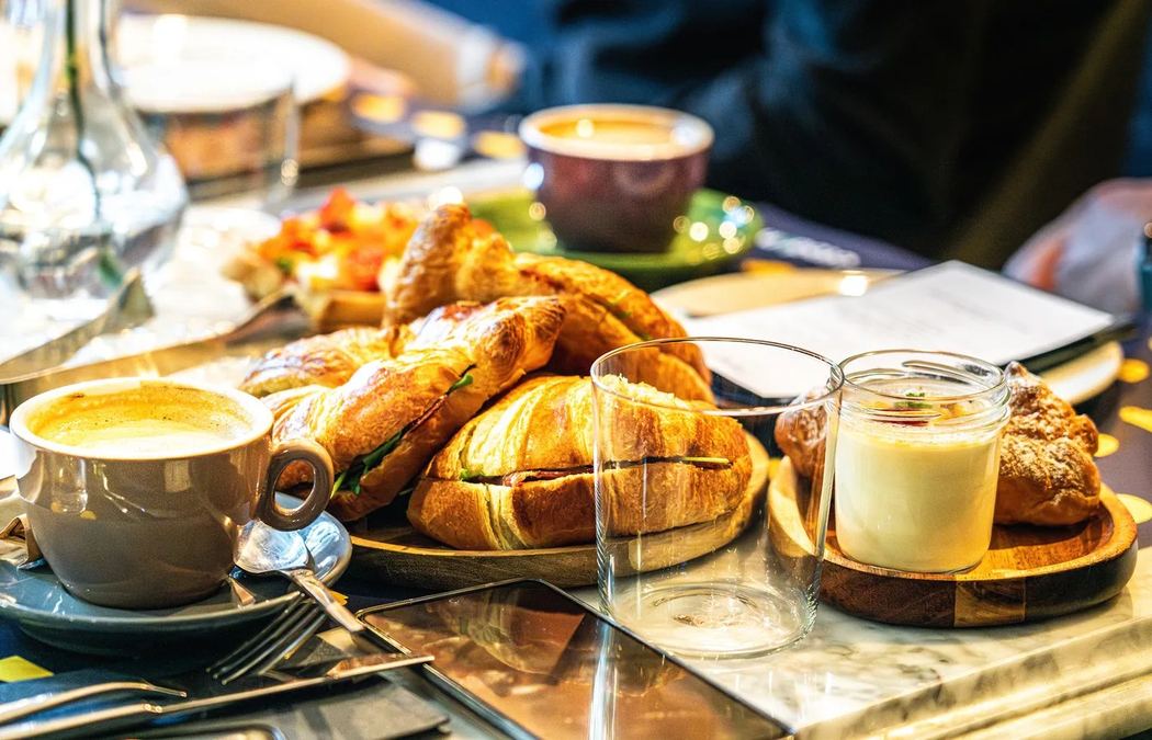 Breakfast table with coffee and pastries
